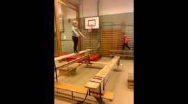A kid doing a big parkour jump