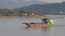 Burmese freighter navigates the 'worryingly low' Mekong River