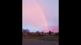 Sunrise with Sahara dust in the Atmosphere and a rainbow in UK .