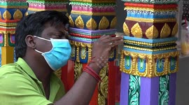 Craftsman painstakingly repaints colourful Hindu temple in Bangkok