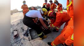 Two-storey building collapses in China as workman was stood on roof