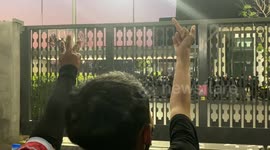 Thai anti-government protestors yell at security officers outside Parliament on Feb 20