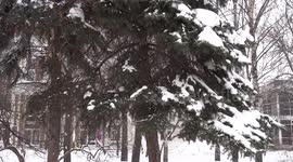 Snow blankets Moscow - bench buried under a snowdrift