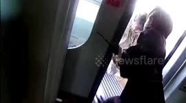 Chinese woman detained after blocking train doors with suitcase and forcing herself on board