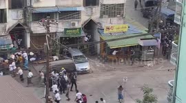 Myanmar police detain woman, use stun grenades to disperse protesters