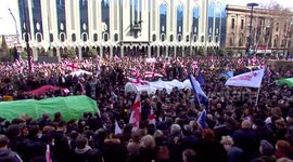 Opposition protesters rally outside Georgia's parliament building in Tbilisi