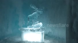Moose ice sculpture inside of an igloo created by the Ice Castle fountain