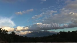 Mount and blue skies set the background of the floating clouds in the afternoon sun TIME LAPSE