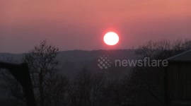 Sun set over Derbyshire after warm weather baths the UK