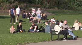Locals gather in UK park to bask in spring sun despite COVID-19 warnings