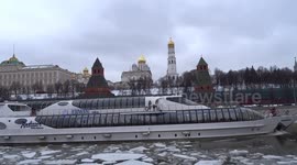 Radisson yacht is gliding along ice-covered river past cathedrals of the Moscow Kremlin