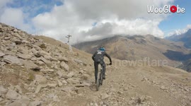 Stray drone strikes speeding cyclist's helmet during mountain descent in Russia