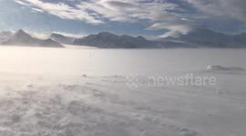 Icy winds blast tents at Union Glacier camp, Antarctica