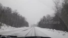 Driving down a New Hampshire freeway in a snow storm