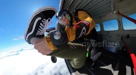 Stunning yet disorientating footage shows a pair of skydivers gripping onto each other as they freefall in a corkscrew.