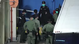 Hong Kong police escort 47 activists to detention centre after security law charges