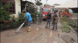 Residents clean up ash-covered streets after Indonesia volcanic eruption