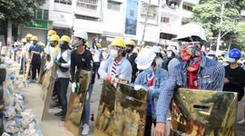 Protesters flee as Myanmar police open fire