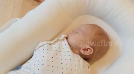 Baby does poo in dad's hand