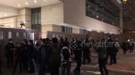 Unrest outside Hong Kong court as democracy activists face hearing