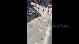 Myanmar police seen dragging and kicking man during protest
