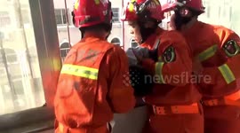 Firefighters rescue 5-year-old boy dangling from fourth-floor window in China