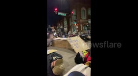 US: General Iron Protesters Stage Die-In To Mark End Of Hunger Strike