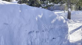 Huge snow drifts cover ground in Yukon, Canada