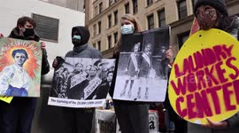 Demonstrators backing New York laundry workers march to mark International Women's Day