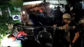 Firefighters drag out five-metre-long python from home in Indonesia