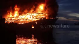 Crews battle fierce boat fire at port in Indonesia