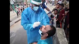 A medical team conducts swabs to check the Corona virus for a number of citizens in Gaza