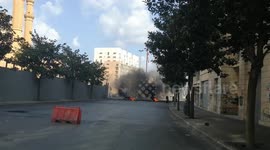 Protesters burn tyres to block roads in Beirut during protest against power cuts and high cost of living