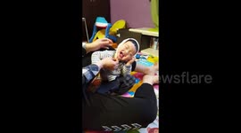 Baby playing hide and seek with dad