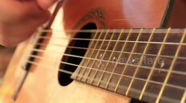 Close up acoustic guitar, relaxing ballad notes, fresh air ambiental sound.