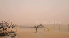Sand storm sweeps through oil drilling base in Saudi Arabia