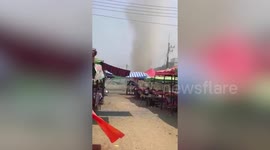 Dust devil tornado rips through Thailand market