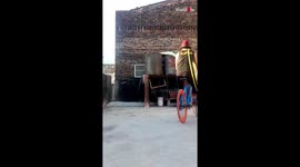 'Multitalented Artist Cycles on One Wheel While Playing Harmonica and Hula Hooping Simultaneously'