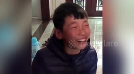 Chinese schoolboy bursts into tears of joy after achieving higher mark in exam
