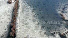 Stunning drone video shows mysterious melting ice patterns in Niigata, Japan