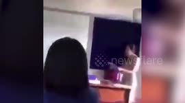 Furious Thai teacher hurls textbooks at students for not doing their homework