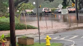 Flooded area on east side oahu in hawaii, more water coming down the mountains filling the streets
