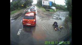 Dash-cam video captures funny moment cyclist falls face-first into puddle