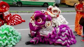 Lion dancers preparing for a procession in Sarawak, Malaysia