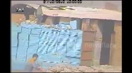 Wind blows building roof onto railway line in China