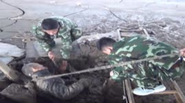 Elderly man pulled out of mud-filled pit in China