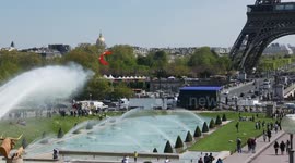 Man kitesurfs in front of Eiffel Tower