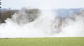 Lime Blowing across Field