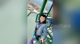 Former paratrooper expresses no emotion as he calmly completes bungee jumps in China
