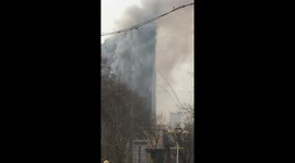 Smoke pours out of Shijiazhuang 26-story Zhong Xin Da Xia Office Building
